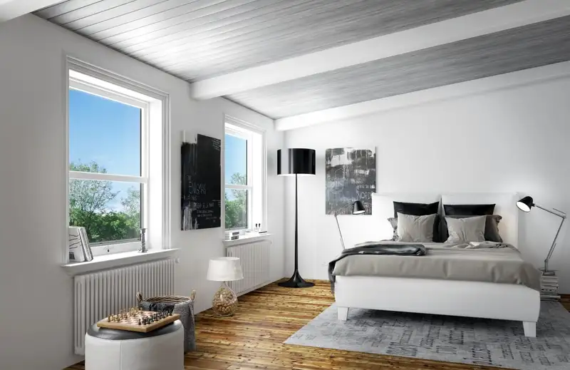 Fenêtre équipée d’une moustiquaire dans une chambre