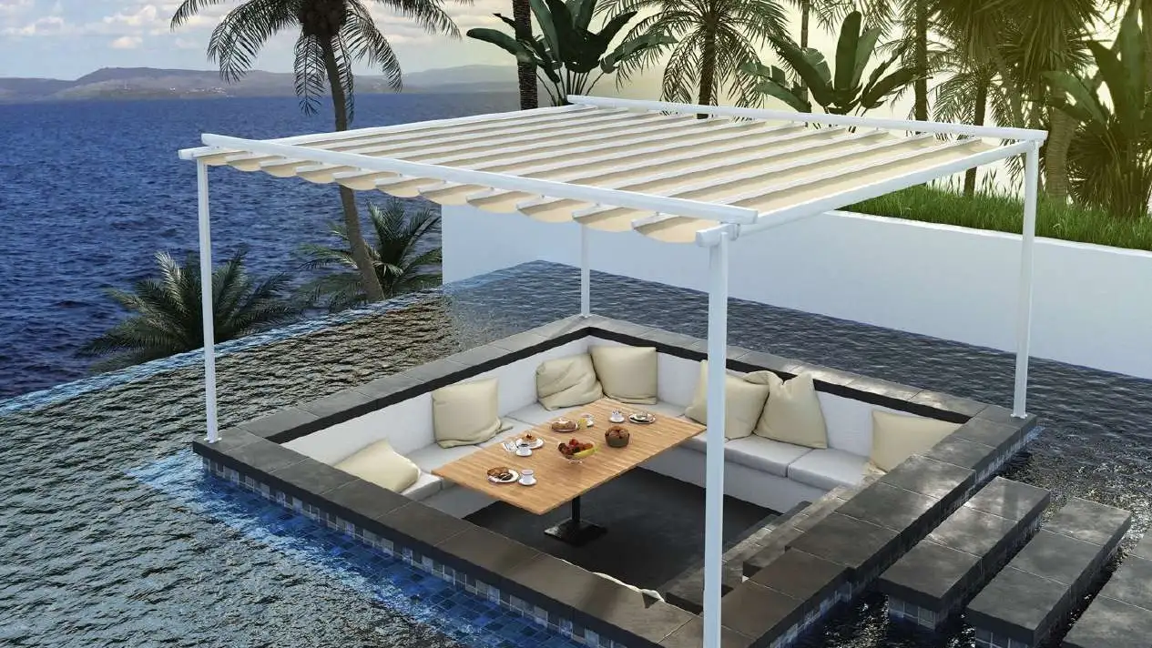 Pergola à vélum Pergozen au-dessus d’un salon extérieur encastré, face à la mer